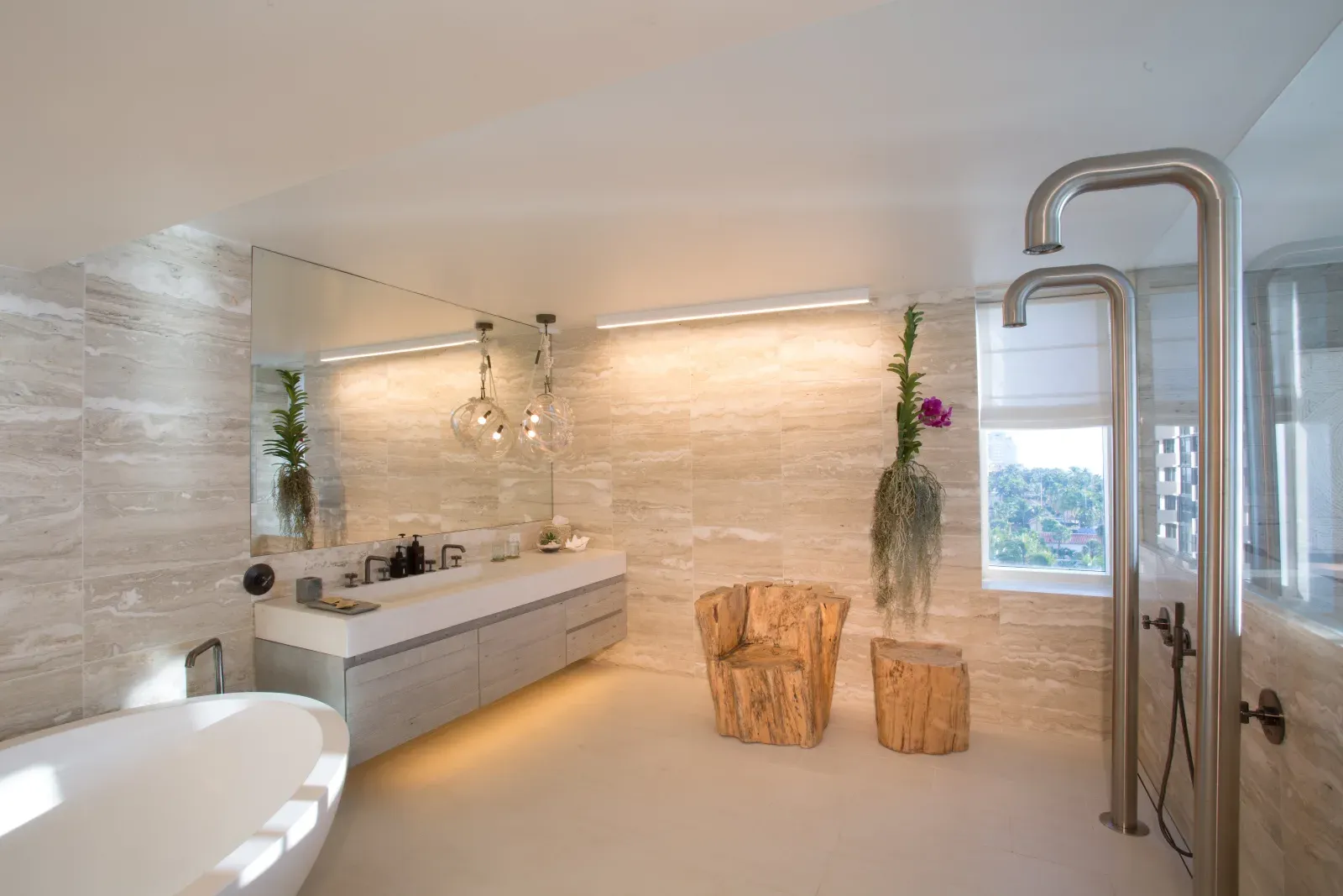 The presidential suite's bathroom, a freestanding tub beside a floor-mounted rain shower and a floor-to-ceiling city view.
