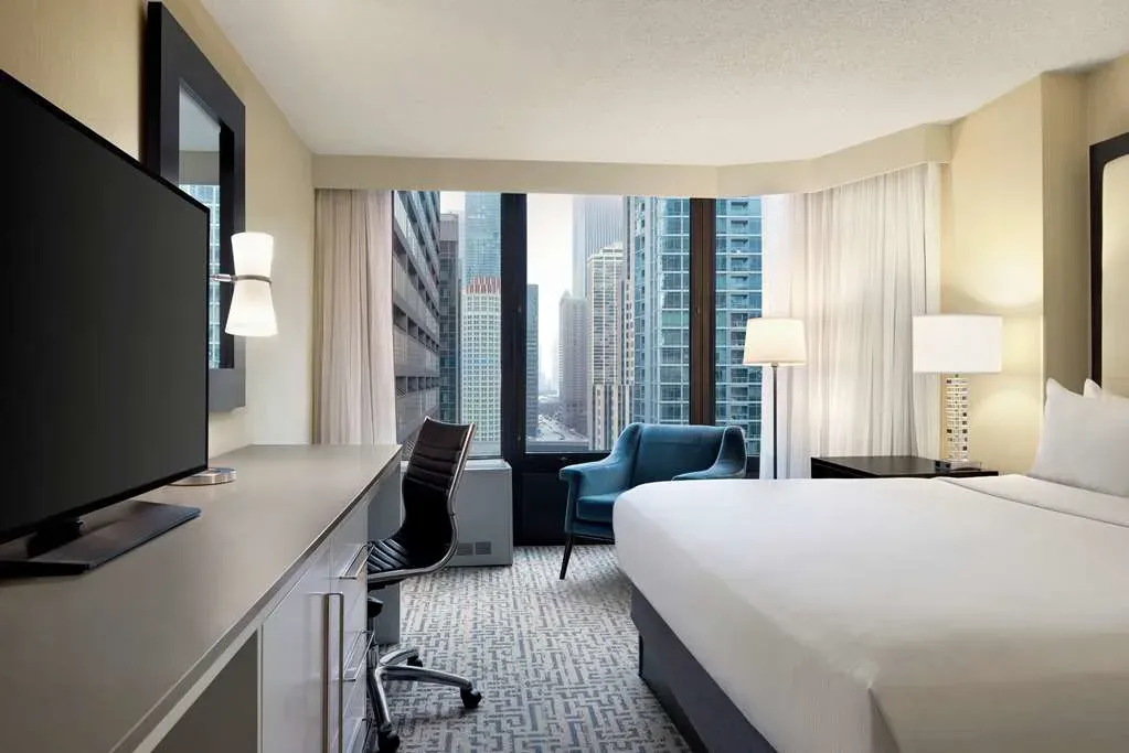 A room facing straight into the tower canyon, teal armchair in the corner.