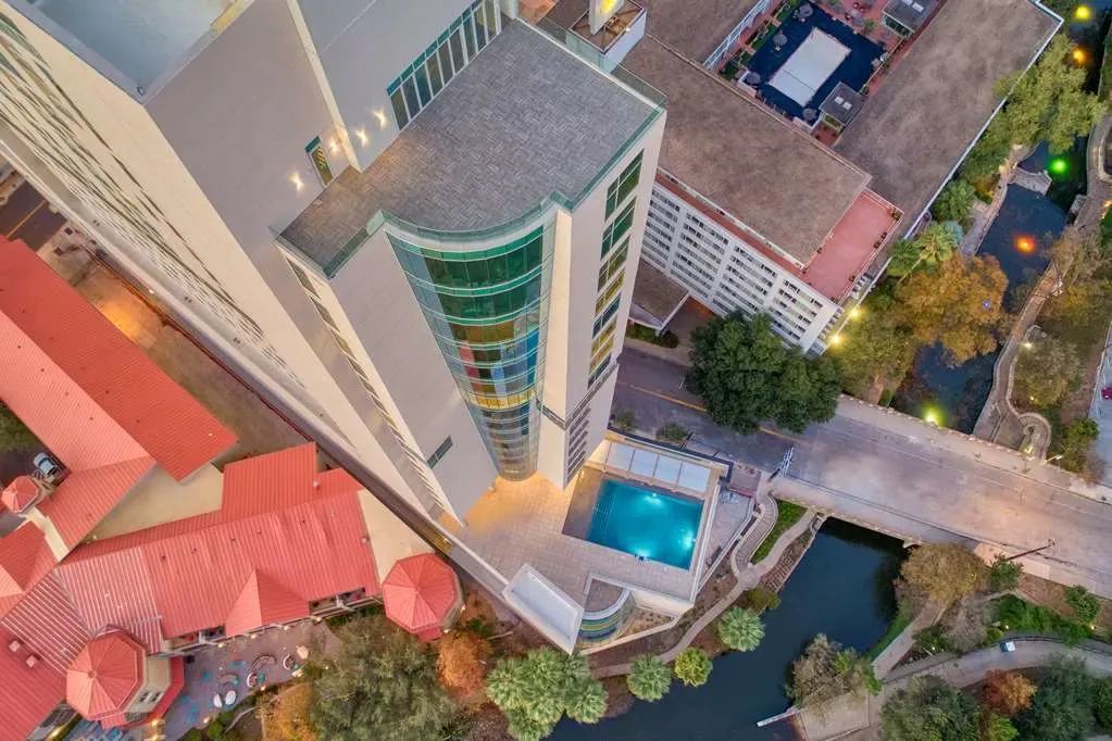 The Cenote pool deck from above, the San Antonio River curving past below.